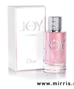 Roza flašica parfema Dior Joy pored bele kutije