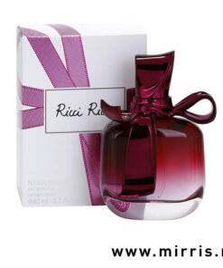 Bočica parfema Nina Ricci Ricci Ricci pored originalne kutije